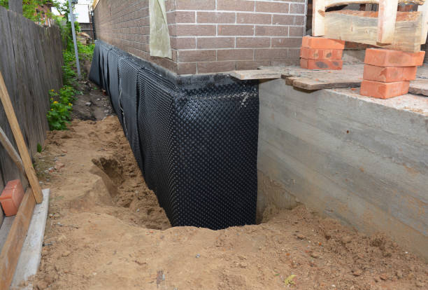 Happy homeowners after waterproofing job in Big Rapids